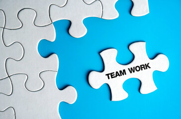 The word teamwork on a puzzle piece. success and strategy concept.                