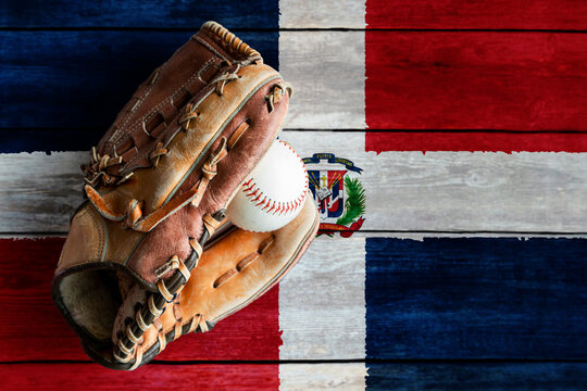 Leather Baseball Glove With Ball on Painted Dominican Republic Flag. Dominican Republic is one of the world's top baseball nations.