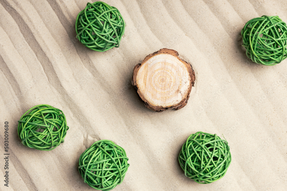 Canvas Prints green balls on the sand and a stump, top view