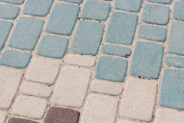 Rectangular artificial stone pavement stretching into the distance in yellow and blue for graphic design