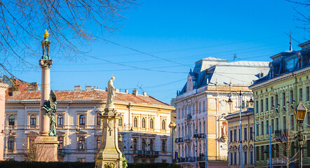 Traditional houses and narrow street in Old town of Lviv, Ukraine. Sunny weather in Lviv