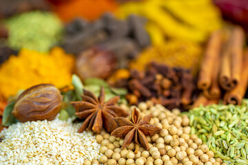 Various spices, peppers and herbs close-up top view. Eastern spice market. A set of peppers and spices for cooking.