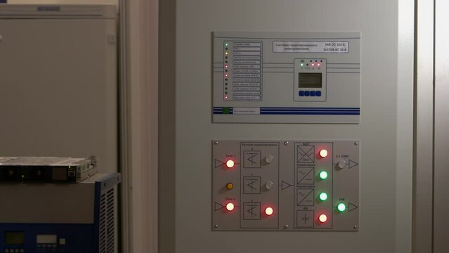 The system of uninterruptible power supply close-up. Control panel with red and green lights.