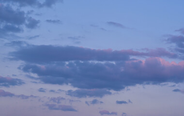 Evening blue sky with beautiful blue and pink clouds