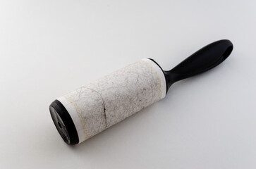 Close-up front view of a used fabric sicky roller