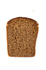 Slice of wholemeal dark bread isolated on a white background in close-up (high details)