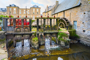 The water mill on the River Aure in the medieval town of Bayeux on the Normandy Coast of France, with bold autumn colors  © Kirk Fisher