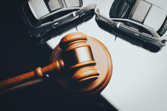 Model of car and gavel. Accident lawsuit or insurance, court case.
