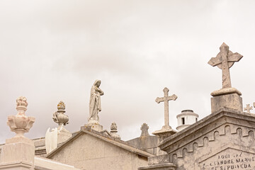  Statue of Virgin Mary and crosses on top of old grave tombs
Download preview
Statue of Virgin Mary...