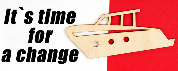On a red and white background, a figure of a yacht and an inscription - It is time for a change