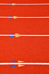 View across polyurethane surface, lane lines and triangular hurdle marks