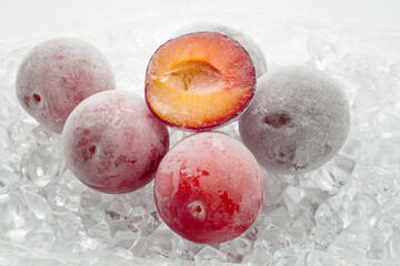 Fresh plum berries on quick freeze ice