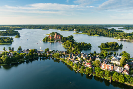Aerial view of Trakai Island Castle and its surroundings, located in Trakai, Lithuania. Beautiful view from the above on summer sunset. © MNStudio