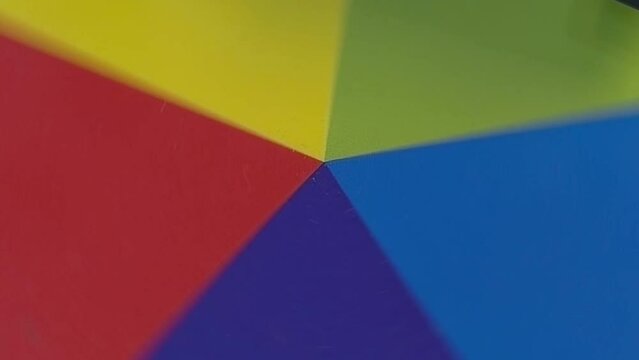 Rotating colored manucature machine disk top view. Print machine in action.