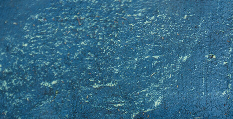 Abstract patterns on puddles of asphalt road.