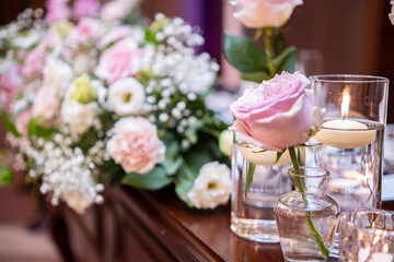 A small pink rose on the wedding Takasago