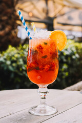 Strawberry mojito with lemon juice, crushed ice and mint