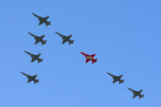Payerne, Switzerland - September 8, 2014: Eight Swiss Air Force Northrop F-5 jets flying in a special formation for the 100th anniversary of the Swiss Air Force.
