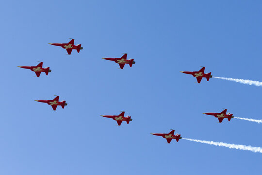 Payerne, Switzerland - September 8, 2014: Eight Swiss Air Force Northrop F-5 jets flying in a special formation for the 100th anniversary of the Swiss Air Force.