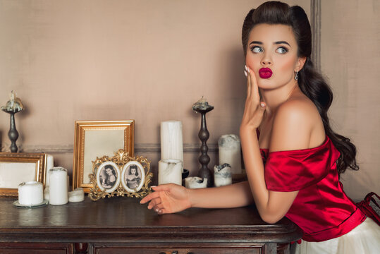Pretty coquettish pin-up girl in retro interior