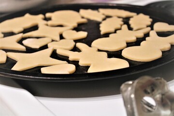 home made shaped cookies on oven tray just about put in oven 