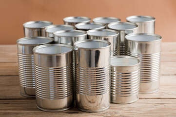 recycled cans, reused on a table with a brown background
