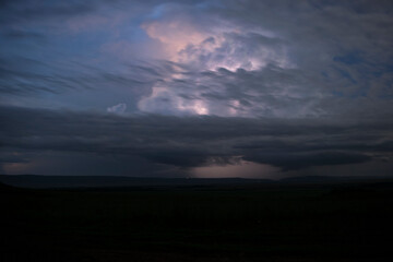 Fototapeta premium Thunderstorm over the Great Rift Valley in the Maasai Mara, Kenya.
