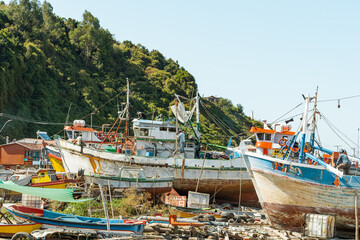 Boats under repair in Caleta Tumbes, Chile