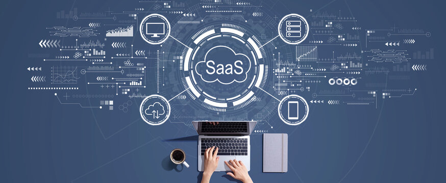 SaaS - software as a service concept with person working with a laptop