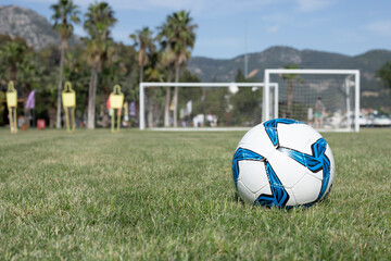 football  ball on the green grass