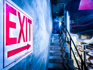 Emergency Exit Sign with Big Red Safety Arrow