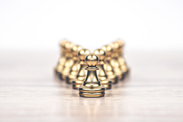 Close-up chess standing first in line teamwork v shape on chess board concepts challenge or battle fighting of business team and leadership strategy and organization risk management or team player.