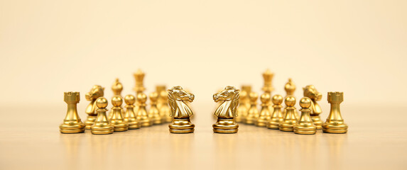 Close-up knight horse chess stand with king on chessboard concepts of teamwork volunteer challenge of business team or wining and leadership strategy and organization risk management or team player.