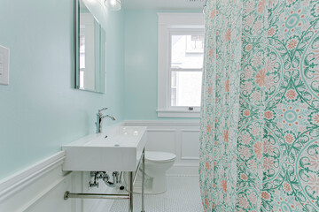 Baby blue interior of historic old architecture bathroom white subway tile backsplash rectangle...