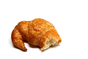 The bitten croissant isolated on the white background