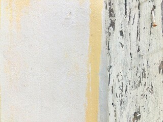 Pastel color painting concrete wall with wooden in the right side. Copy space for text or topic on the left side.