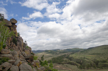 Steep rocky mountainside. View of the mountainside from the side.