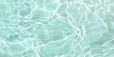 de-focused. Closeup of light blue transparent clear calm water surface texture with splashes and bubbles. Trendy abstract summer nature background. for a product, advertising,text space.
