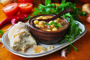 Harira soup in bowl on table. Typical Moroccan food.