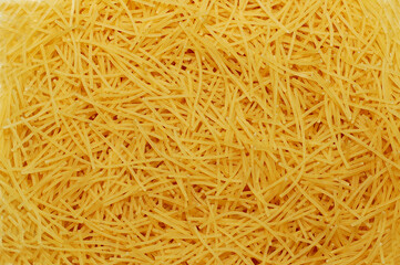 Vermicelli. Background from thin vermicelli. short spaghetti