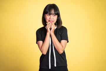 portrait of cynical asian woman expression while standing over isolated background - obrazy, fototapety, plakaty