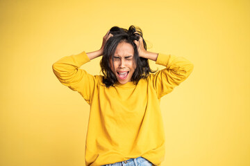 angry asian woman screaming and shouting over isolated background