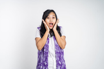 portrait of young asian woman feeling shocked and suprised over isolated background