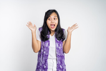 portrait of young asian woman feeling shocked and suprised over isolated background