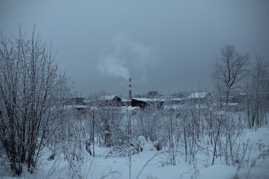 Winter Prep With Factory Pipe. View Of Industrial Area.