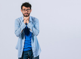 Man asking please, guy putting hands together asking please, worried man apologizing, Hopeful man asking for help or apologizing, man thanking for forgiveness