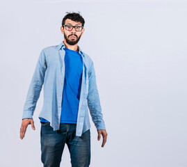 Surprised bearded man looking into the camera, surprised and discovered young man looking at the...