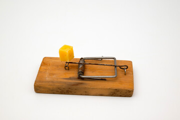 Close up of mouse trap on old wooden table.