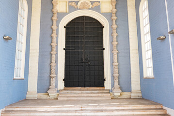 Fototapeta na wymiar wooden church doors with ornate metal hardware