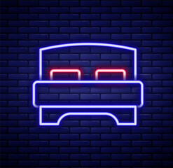 Glowing neon line Big bed for two or one person icon isolated on brick wall background. Colorful outline concept. Vector